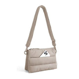 Beige minimalist padded travel crossbody bag with adjustable shoulder strap