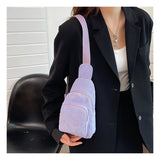 Lavender corduroy sling bag worn over the shoulder