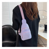 Lavender corduroy sling bag worn at the back