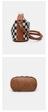 Brown trim mini bag side view, detachable strap and oval PU base.