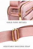 Gold-tone zipper hardware and adjustable woven shoulder strap
