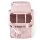 Open organizer showing divided storage, mesh pocket and brush compartment