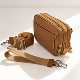 brown nylon wallet in three-quarter side view with matching wristlet and crossbody straps